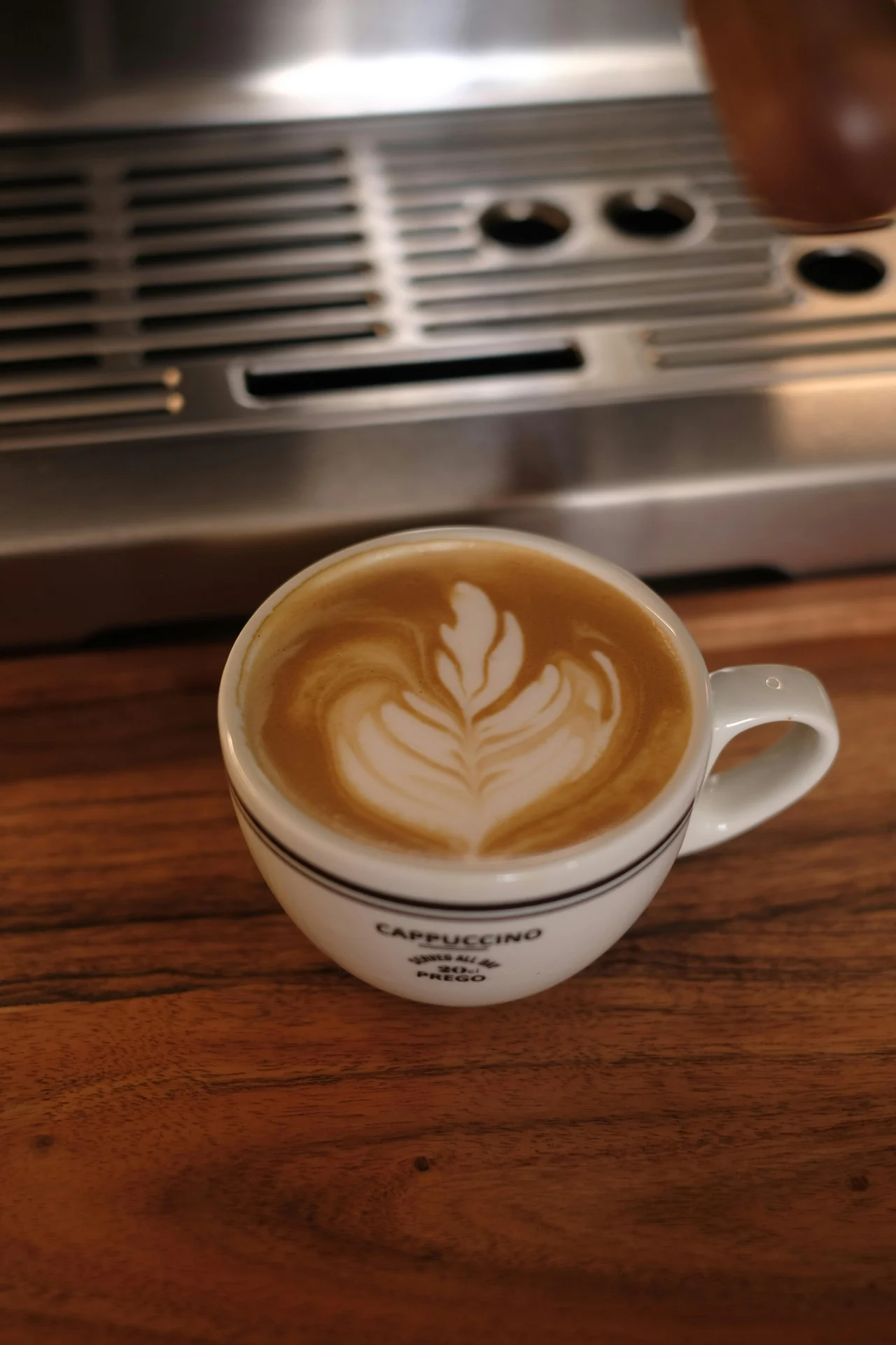 Home espresso machine making cappuccino